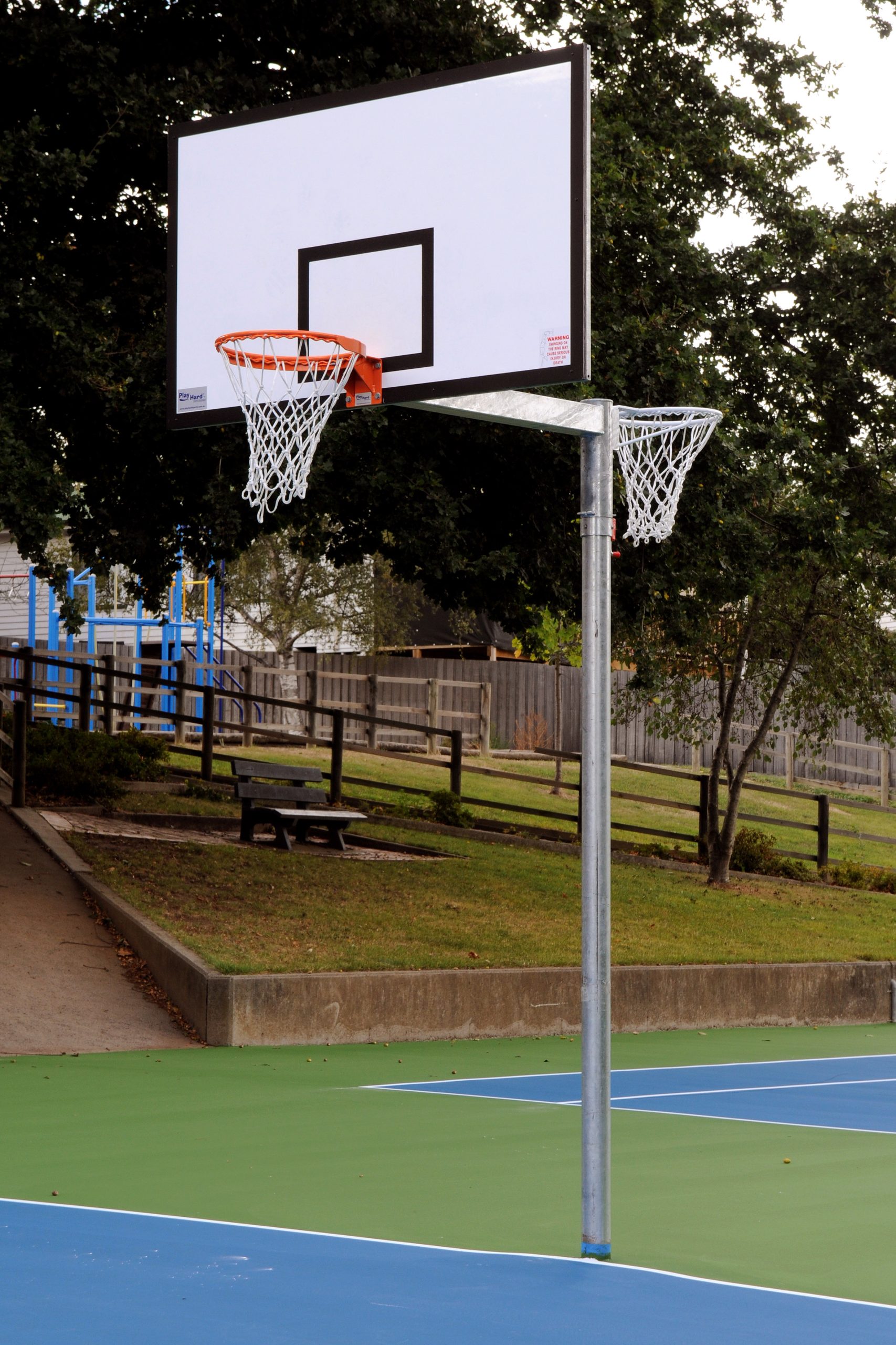 Basketball hoop, basketball unit, basketball tower, basketball ring, acrylic basketball backboard, rotating basketball hoop, basketball and netball hoop, rotating basketball hoop, play hard, playhard, play hard sports, hard sports, backboard, basketball backboard, rotating tower, side swing tower, rotating hoop, side swing hoop, basketball netball hoop, school sporting equipment, phs basketball, phs sports, fixed basketball hoop, basketball equipment manufacturers, basketball court equipment, outdoor equipment basketball